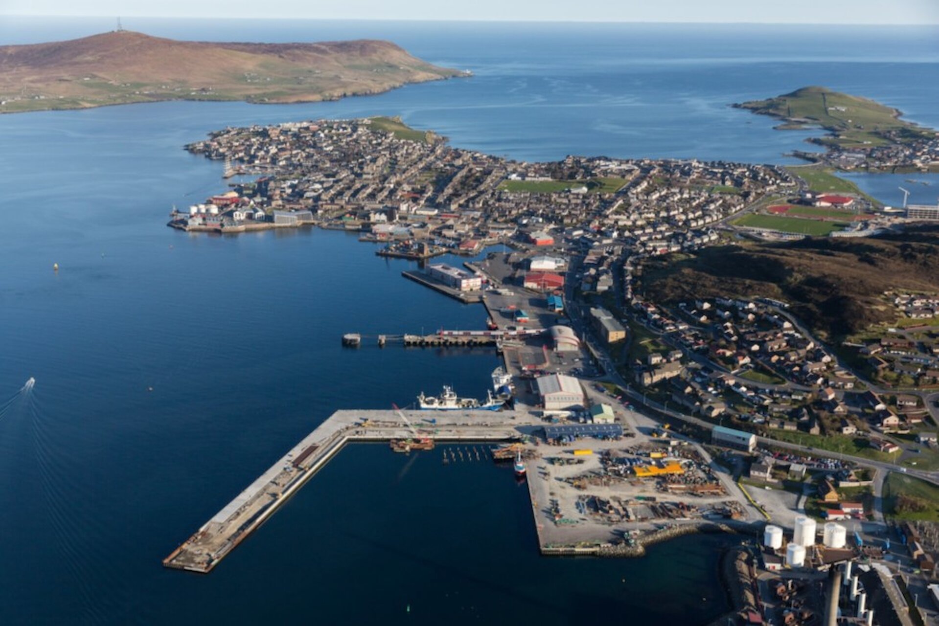 Under construction, with the demolition of the original jetty underway.