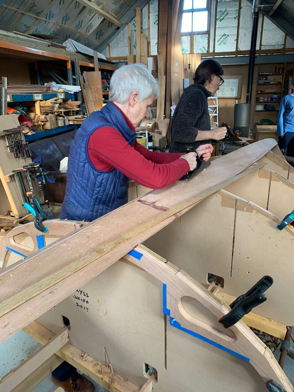 Rowing club members working on the Wemyss skiff